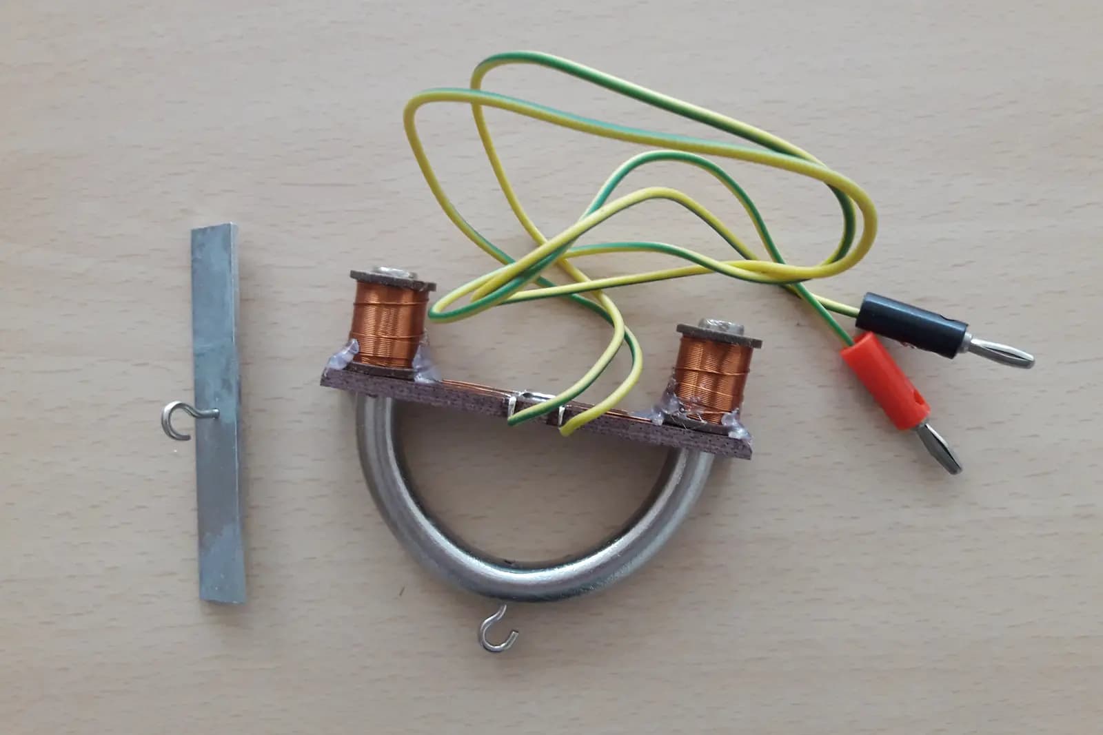 Representative open-core electromagnet demonstrator with two copper coils and test leads